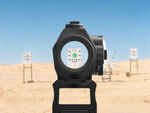 EZSHOOT red dot sight aiming at a target in a desert shooting range.