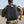 Person wearing a black backpack with an American flag patch -EZshoot 40L Molle Rucksack Assault Pack for Men Women